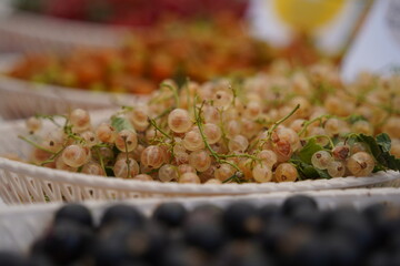 Berries on a large plate on the table. Summer harvest.