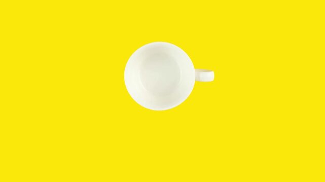 Looping stop motion animation of endless drinking coffee cup by cup on yellow background. Copy space for your text.