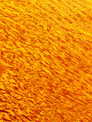 Radiant Fire Water Ripples or Golden Water Texture - High-Resolution Abstract Background for Screensavers, Web Design, Marketing. Stunning Stock Photography 