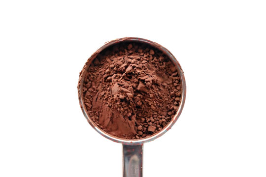Cocoa powder in measuring cup isolated on transparent background with clipping path