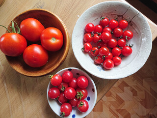 Various assorted tomatos harvested in kitchen garden /...