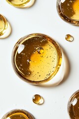 An array of textured glass orbs filled with golden liquid and bubbles, demonstrating a fascinating play of light that adds depth to the overall artistic presentation.