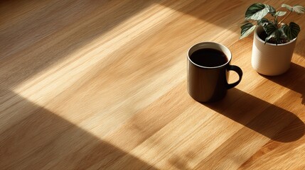 Top down view of minimalist clean wooden desk surface bathed in soft morning sunlight in cozy home interior. Warm natural tones, tranquil workspace concept, peaceful and modern Scandinavian design.

