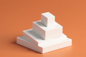 Stacked white boxes on a surface, possibly used as decorative or storage solution