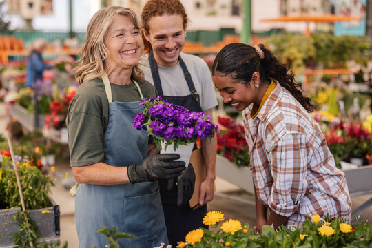 Florist and customers enjoying a moment in a flower shop
