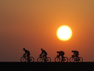 View of sunrise time with orange sky. Background is blurred. Mini toy of action figure at outdoor with blurred background. Miniature photography concept design.