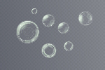 Realistic collection of flying soap bubbles on transparent background. Glossy and clear spheres for cosmetic design, clean air effects, children's themes, summer fun visuals or bathroom decoration con