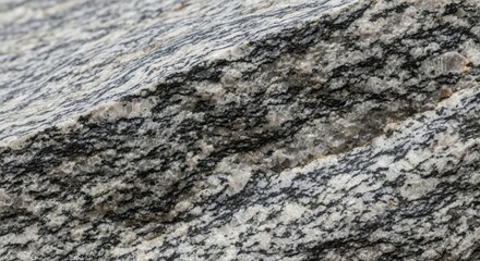 Close-up of natural granite rock surface with striated texture