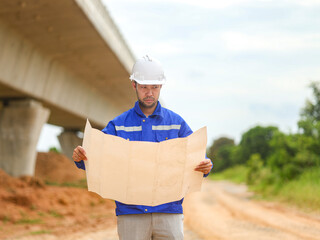 Back one architect standing outdoor at home building construction site