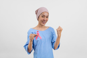 Happy asian woman cancer patient holding cancer awareness ribbon campaign ribbon to symbolize her...