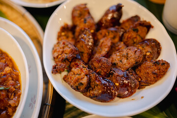 Spicy sausage slices served in white bowl with rich texture and savory flavor, perfect for hearty meal or appetizer with satisfying taste and aroma