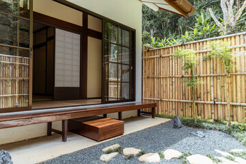 Japanese garden bamboo fence wooden bench gravel stone path outdoor patio t cell cancer treatment...