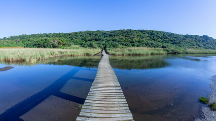 Hiking Path Wood Bridge Over Wetland Lagoon River Water.