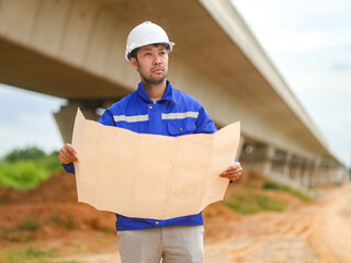 Back one architect standing outdoor at home building construction site
