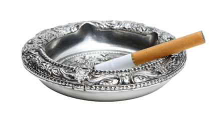 Silver ashtray with a cigarette resting on it