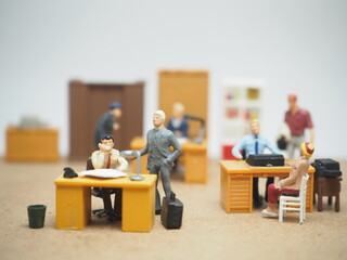 Mini toy of action figure at table with blurred background. Diorama photography concept design....