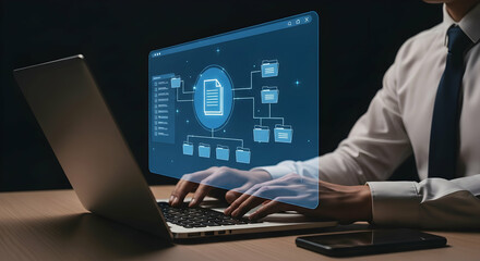 Person using laptop with a holographic file system overlay