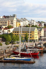Pastel coloured buildings along the coastline of Kristiansund, Norway	
