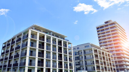Modern apartment buildings on a sunny day with a blue sky. Facade of a modern apartment building....