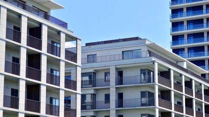 Modern apartment buildings on a sunny day with a blue sky. Facade of a modern apartment building....