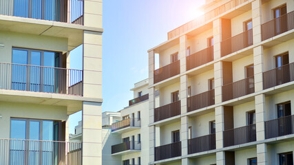Modern apartment buildings on a sunny day with a blue sky. Facade of a modern apartment building....