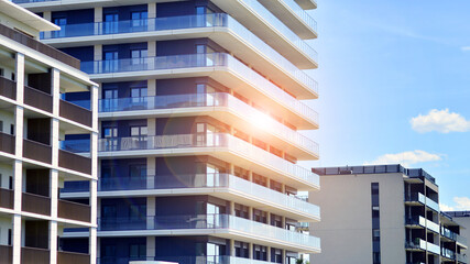 Modern apartment buildings on a sunny day with a blue sky. Facade of a modern apartment building....