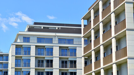Modern apartment buildings on a sunny day with a blue sky. Facade of a modern apartment building....