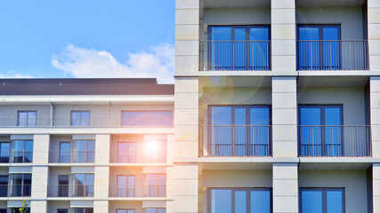 Modern apartment buildings on a sunny day with a blue sky. Facade of a modern apartment building. Modern residential apartment building complex condo.