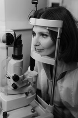 Woman undergoing professional eye exam with advanced ophthalmology diagnostic equipment