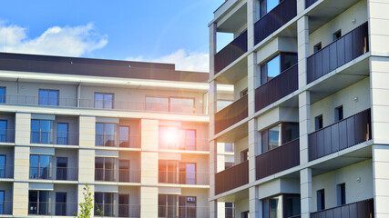 Modern apartment buildings on a sunny day with a blue sky. Facade of a modern apartment building. Modern residential apartment building complex condo.