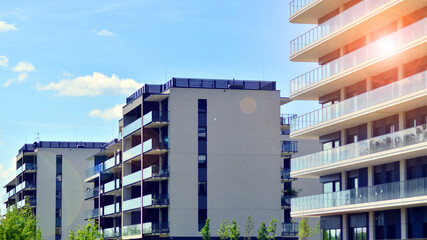 Modern apartment buildings on a sunny day with a blue sky. Facade of a modern apartment building. Modern residential apartment building complex condo.