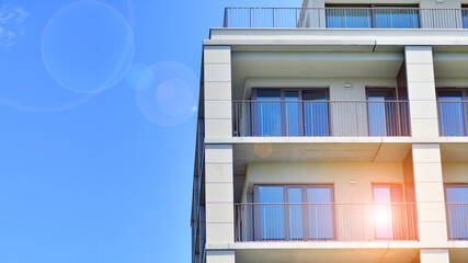 Modern apartment buildings on a sunny day with a blue sky. Facade of a modern apartment building. Modern residential apartment building complex condo.