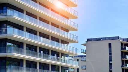 Modern apartment buildings on a sunny day with a blue sky. Facade of a modern apartment building. Modern residential apartment building complex condo.