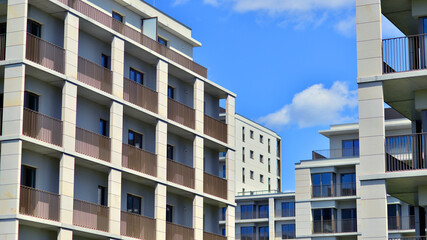 Modern apartment buildings on a sunny day with a blue sky. Facade of a modern apartment building. Modern residential apartment building complex condo.