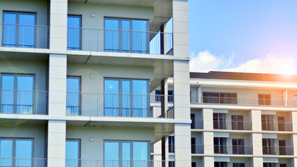 Modern apartment buildings on a sunny day with a blue sky. Facade of a modern apartment building. Modern residential apartment building complex condo.