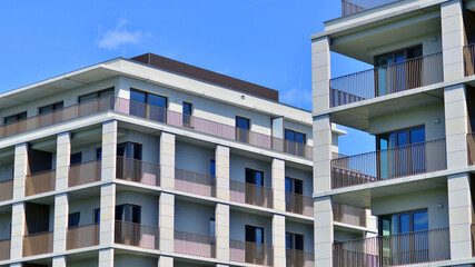 Modern apartment buildings on a sunny day with a blue sky. Facade of a modern apartment building. Modern residential apartment building complex condo.