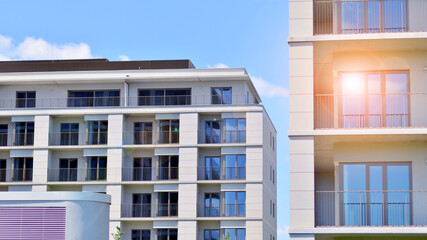 Modern apartment buildings on a sunny day with a blue sky. Facade of a modern apartment building. Modern residential apartment building complex condo.