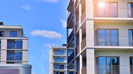 Modern apartment buildings on a sunny day with a blue sky. Facade of a modern apartment building. Modern residential apartment building complex condo.