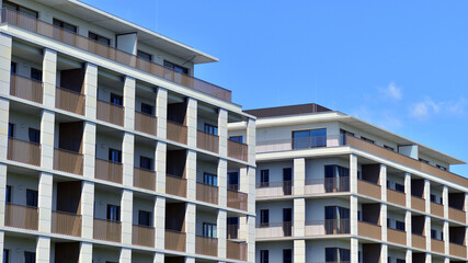 Modern apartment buildings on a sunny day with a blue sky. Facade of a modern apartment building. Modern residential apartment building complex condo.