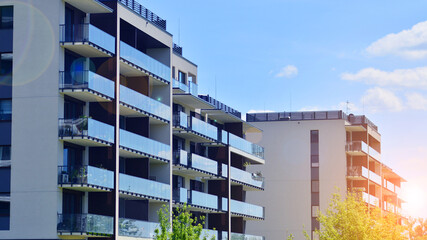 Modern apartment buildings on a sunny day with a blue sky. Facade of a modern apartment building. Modern residential apartment building complex condo.