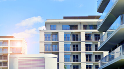 Modern apartment buildings on a sunny day with a blue sky. Facade of a modern apartment building. Modern residential apartment building complex condo.