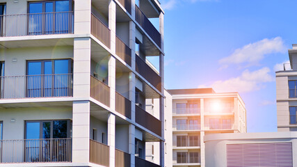 Modern apartment buildings on a sunny day with a blue sky. Facade of a modern apartment building. Modern residential apartment building complex condo.