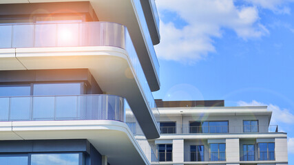 Modern apartment buildings on a sunny day with a blue sky. Facade of a modern apartment building. Modern residential apartment building complex condo.