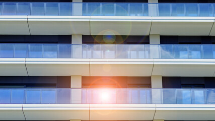 Modern apartment buildings on a sunny day with a blue sky. Facade of a modern apartment building. Modern residential apartment building complex condo.