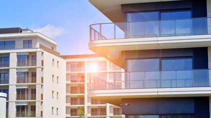 Modern apartment buildings on a sunny day with a blue sky. Facade of a modern apartment building. Modern residential apartment building complex condo.