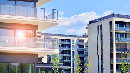 Modern apartment buildings on a sunny day with a blue sky. Facade of a modern apartment building. Modern residential apartment building complex condo.
