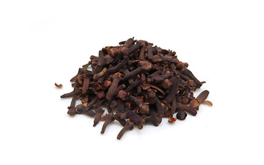 A Pile of Cloves on white background isolated, close up, herbs and spices
