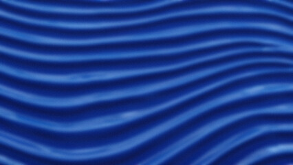 Undulating blue fabric texture with smooth horizontal wave patterns creating a dynamic slightly blurred visual effect