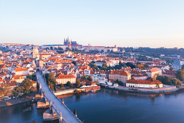 Morning light casts a warm glow over Prague, illuminating the cityscape and medieval architecture...