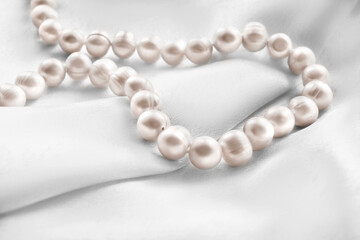 Pearls on white silk